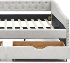 Gray upholstered bed with trundle and wooden drawers