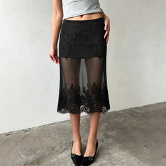 Close-up of the lace detailing on the sheer midi skirt.