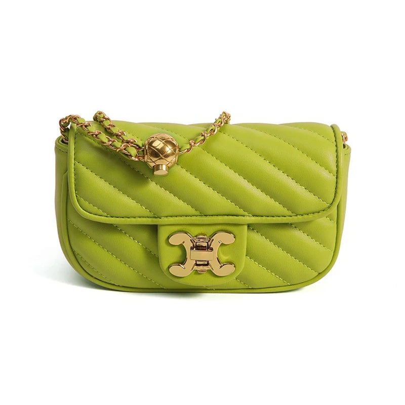 A stylish crossbody bag with an adjustable shoulder strap and a unique ball detail, showcased against a neutral background.