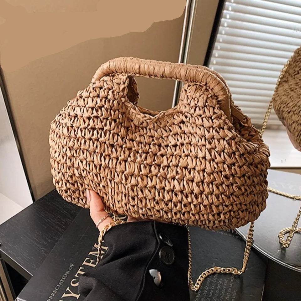 Woven handbag held by a person 