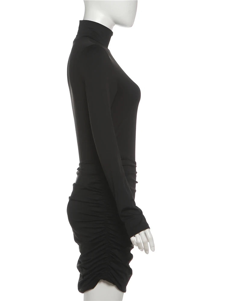 Black long-sleeve dress on a mannequin against a white background