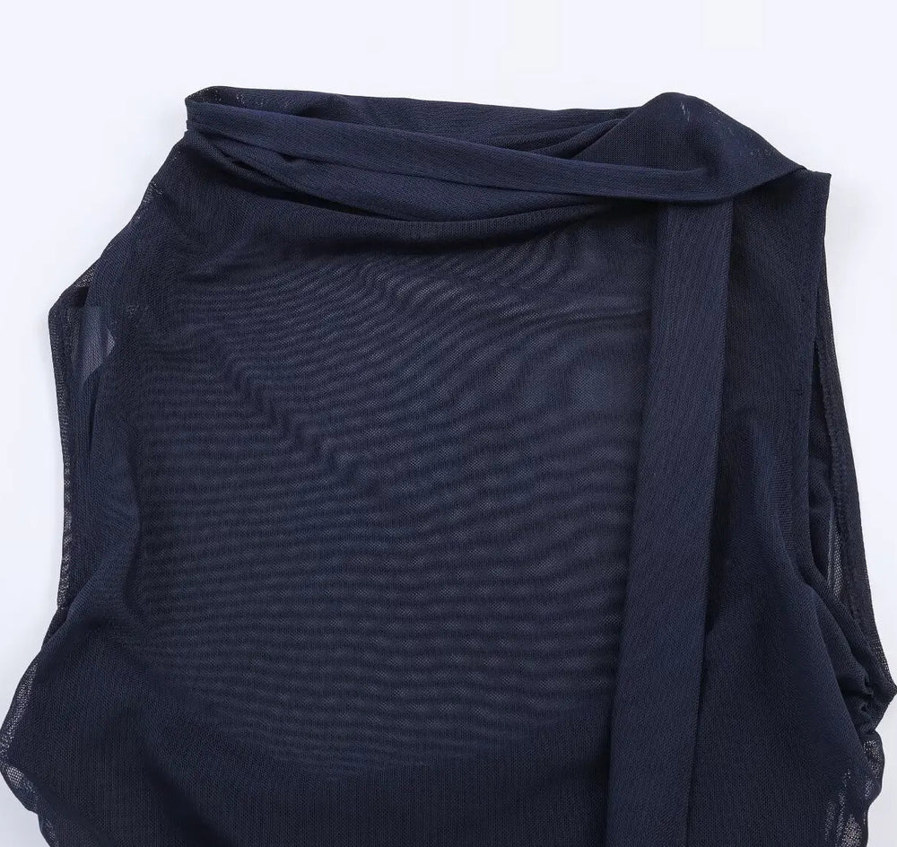 Navy blue fabric draped over a white background