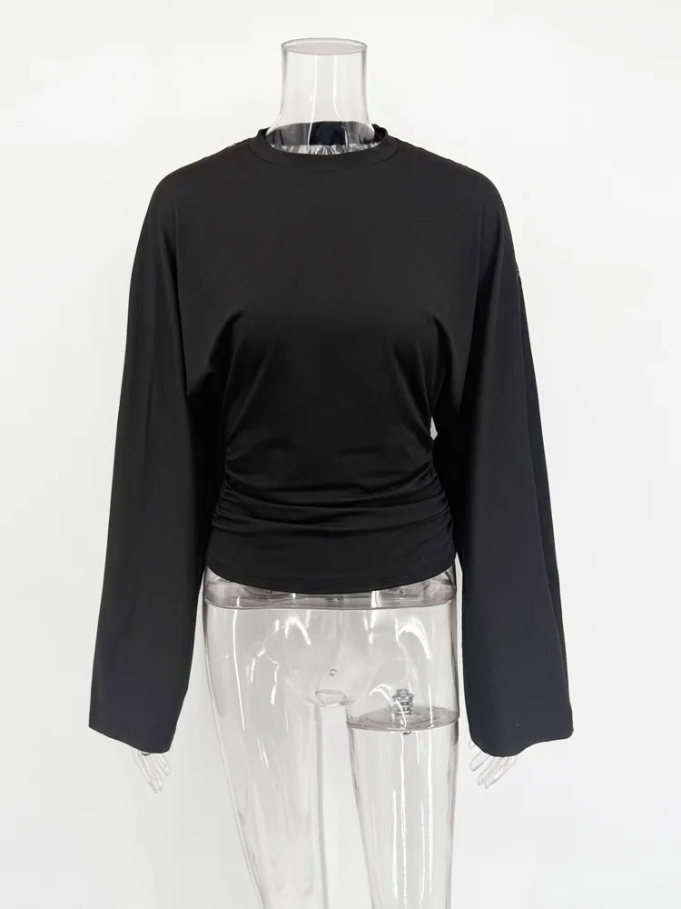Black long-sleeve top on a mannequin against a white background