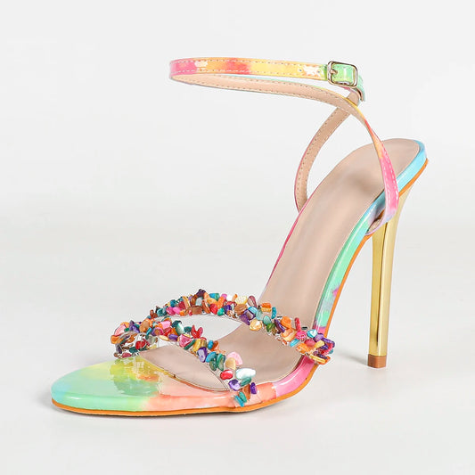 Single multi-color gem embellished ankle strap high heel sandal on a white background.