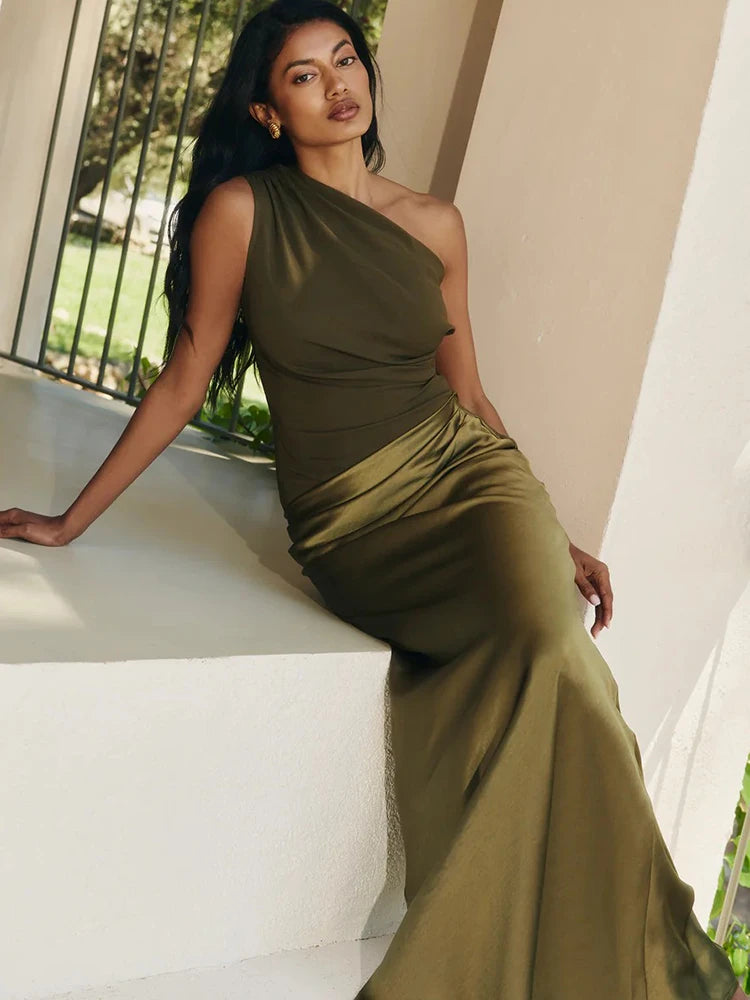 Olive green one shoulder draped maxi dress seated