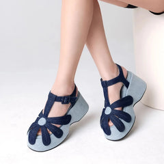 Denim platform sandals with flower detail and T-strap.