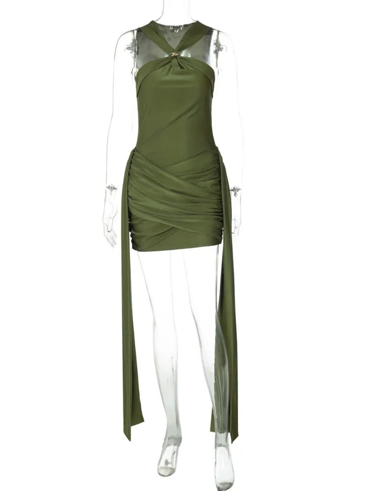 Green dress on a mannequin against a white background