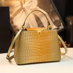 A luxurious gradient crocodile pattern leather bag with a prominent V-letter accent. Golden Atelier 3