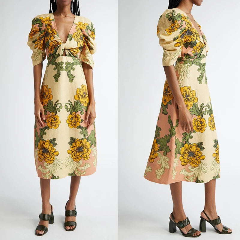 Woman wearing a floral dress with yellow and green flowers on a white background