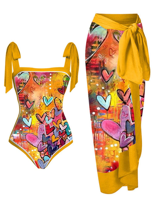 Vibrant heart print bikini set with tie straps and a matching wrap sarong.