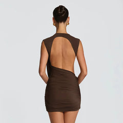 Brown dress with open back worn by a model on a light gray background
