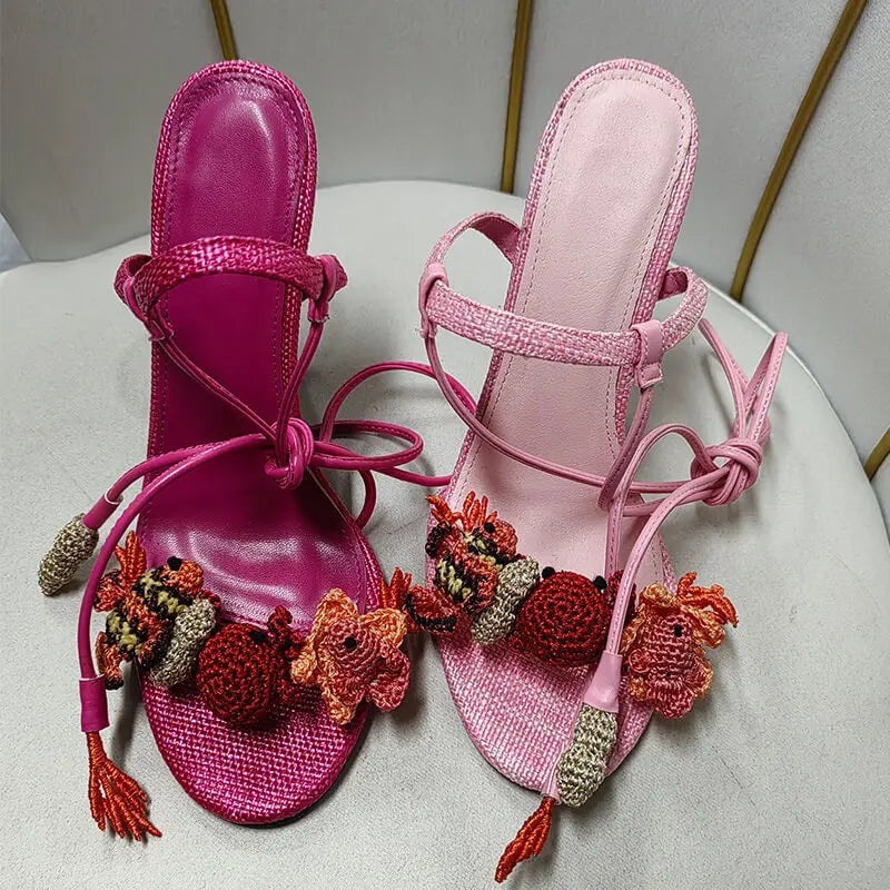Close-up of embellished lace-up stiletto sandals toe detail
