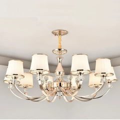 Chandelier with six light bulbs on a plain background