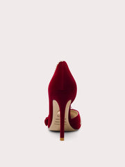 Red high-heeled shoe with a white sole on a light gray background