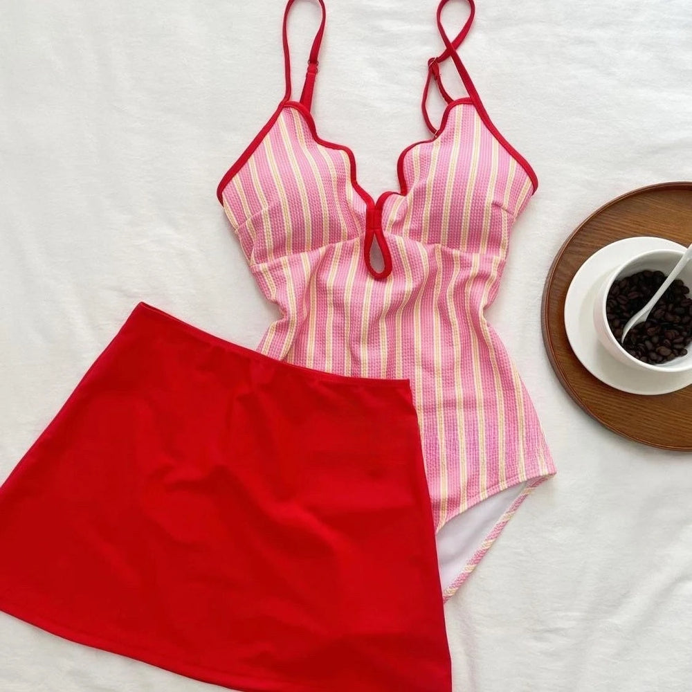 Pink striped bikini top with red trim and red skirt