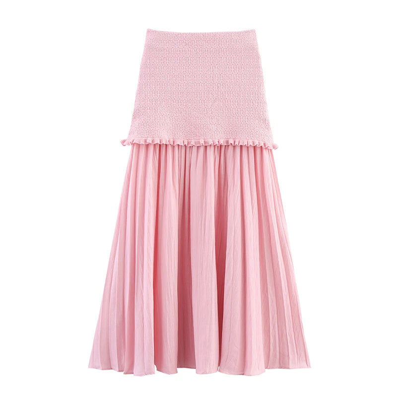 Pink skirt with textured top and pleated bottom on a white background