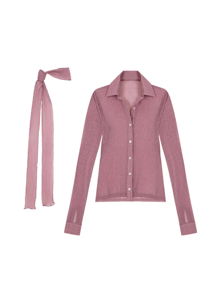 Pink long-sleeve shirt with a matching bow tie on a white background