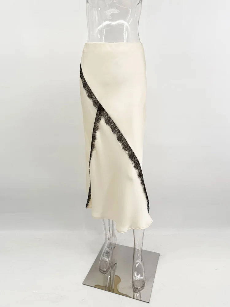 White skirt with black abstract pattern on a mannequin against a white background