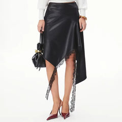 Close-up of lace trim on an asymmetrical faux leather midi skirt