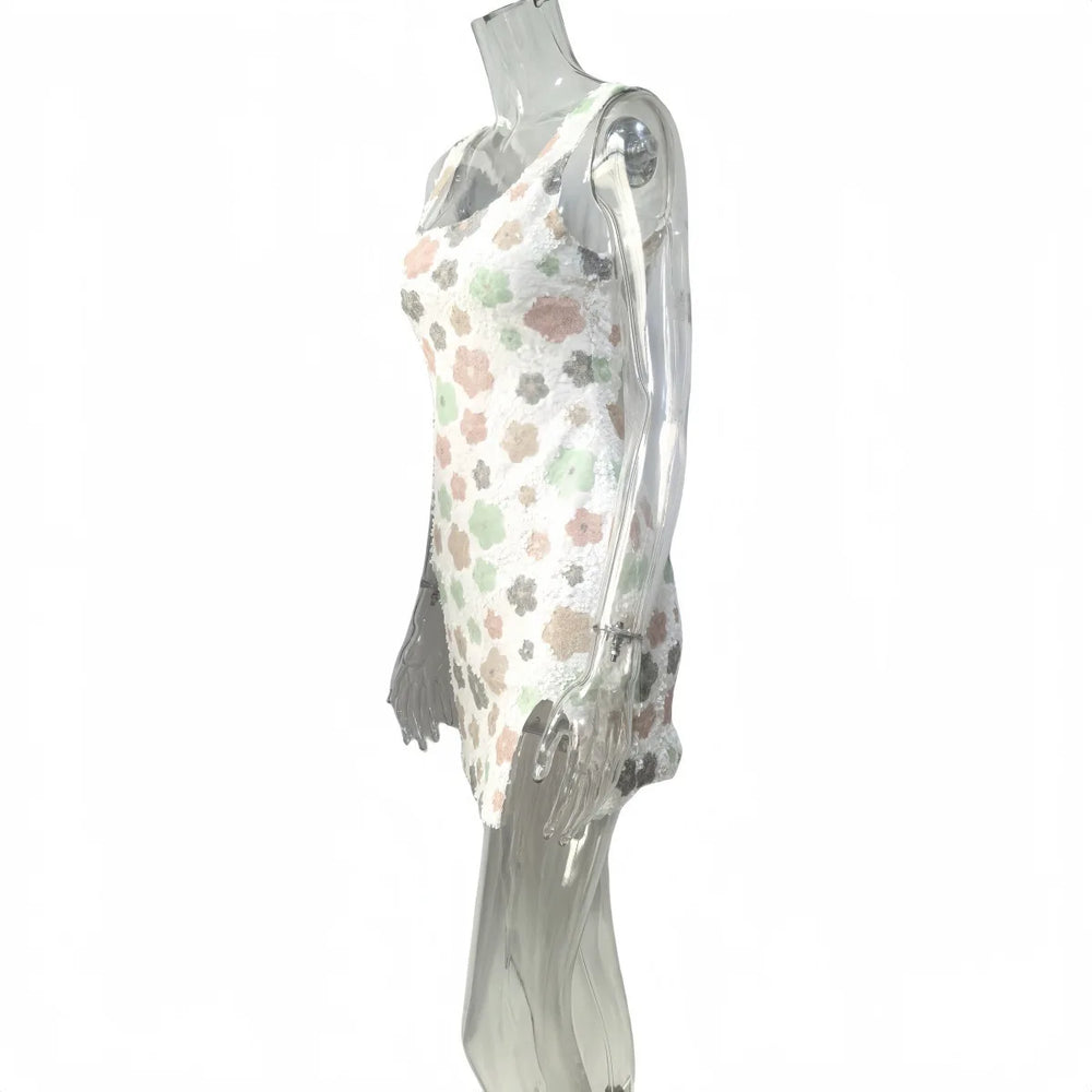 Floral dress on a mannequin against a white background