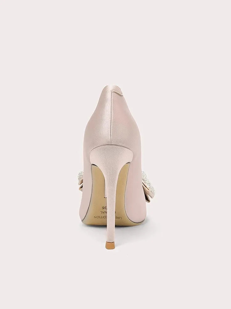 Beige high-heeled shoe on a white background