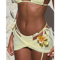 Close-up of bikini bottoms and twist front mini skirt detail