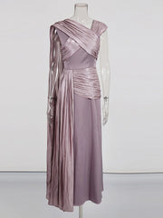 Mauve evening gown on a mannequin against a white background