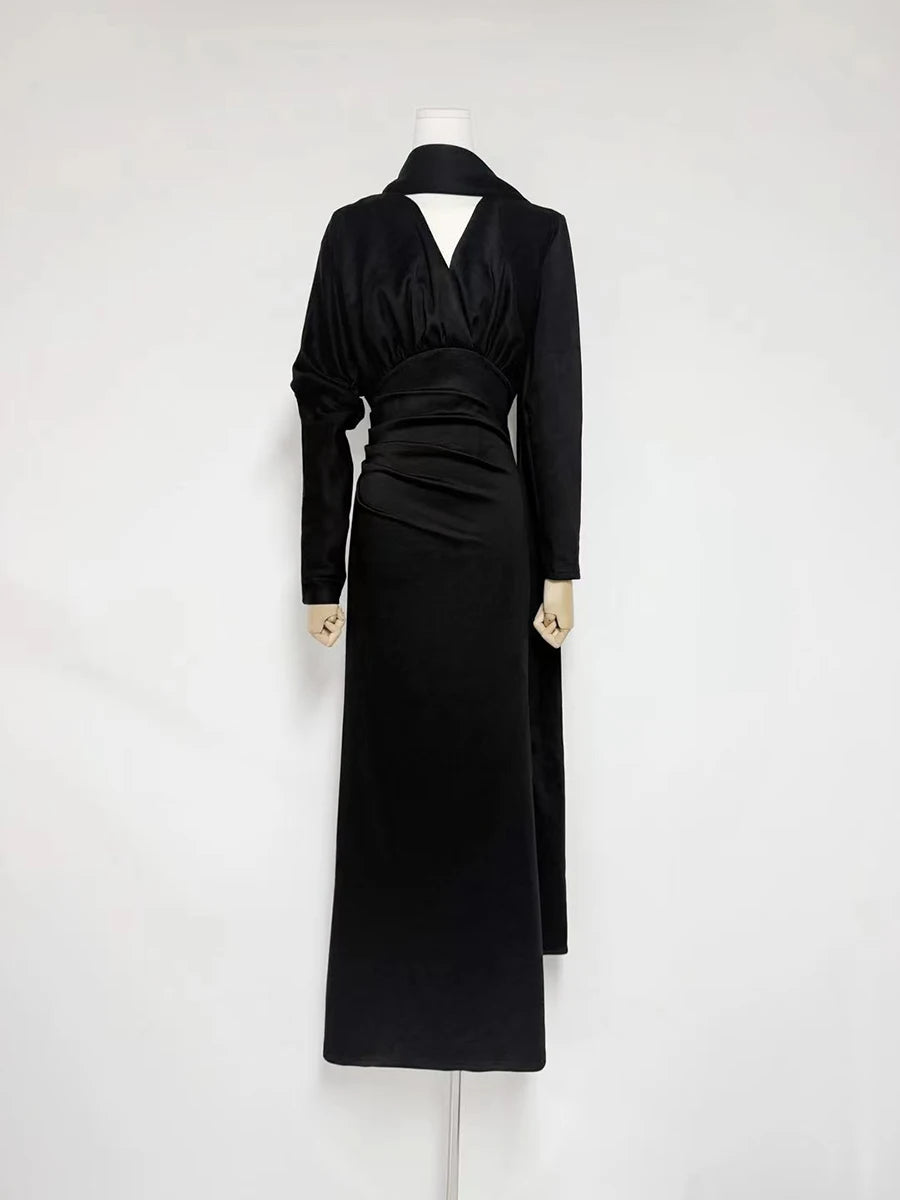 Black dress on a mannequin against a white background