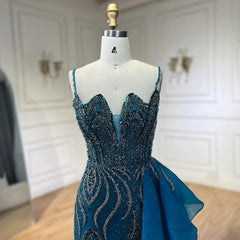 Mannequin  displaying  the beaded mermaid evening gown with overskirt, showcasing its flattering silhouette and graceful movement. Golden Atelier 4