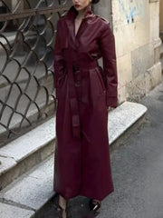 Burgundy faux leather trench coat with belted waist