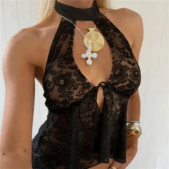 Close-up of a black floral lace halter crop top showing intricate detail.