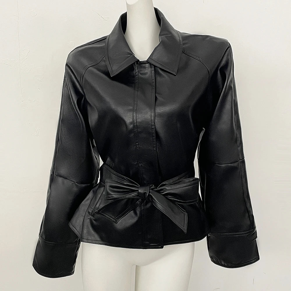 Black faux leather jacket displayed on a mannequin