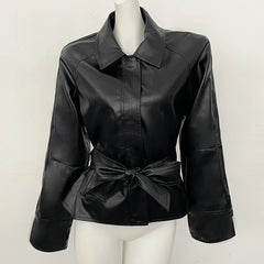 Black faux leather jacket displayed on a mannequin