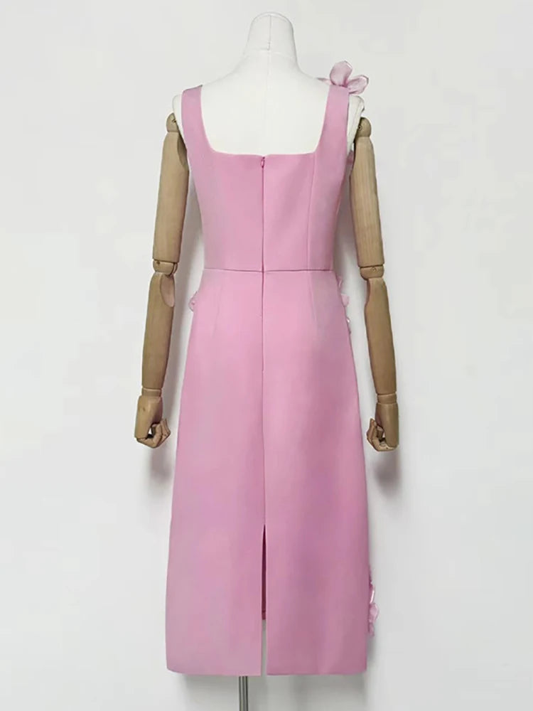 Pink dress on a mannequin against a white background