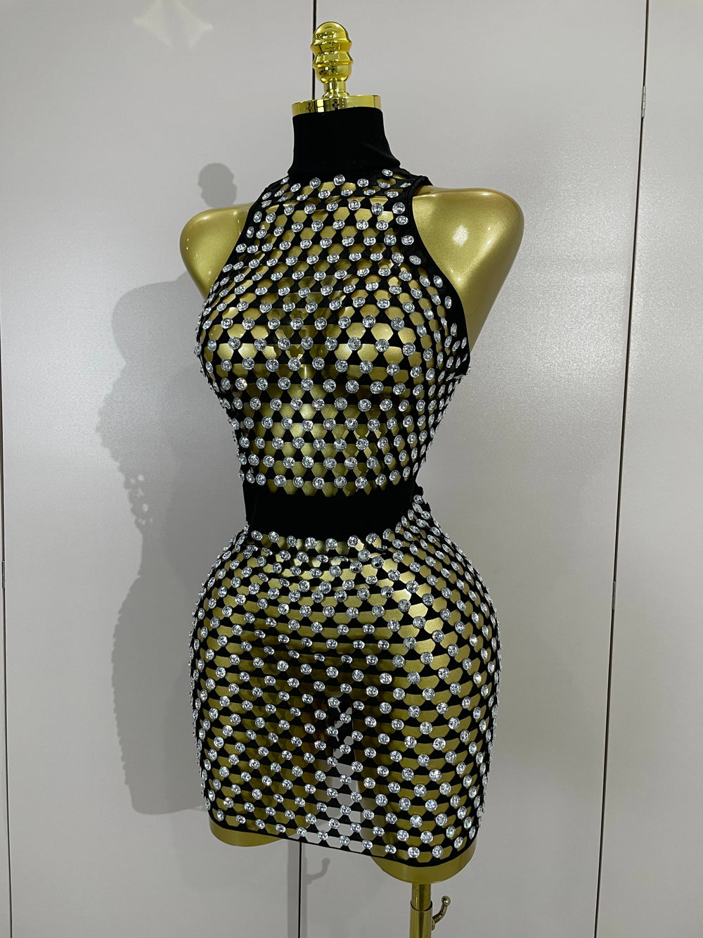 Close-up of sparkling mesh mini dress applique detail