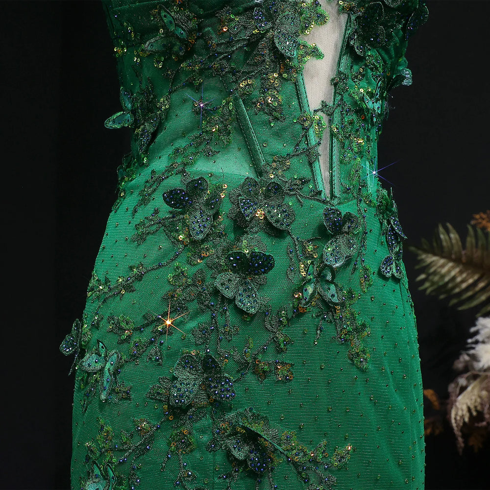 Green embroidered garment with intricate detailing on a dark background