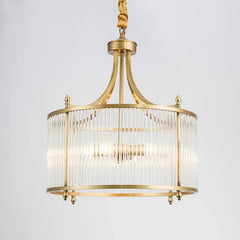  Modern gold chandelier with cascading glass pendants, illuminating a stylish living room. Golden Atelier 3