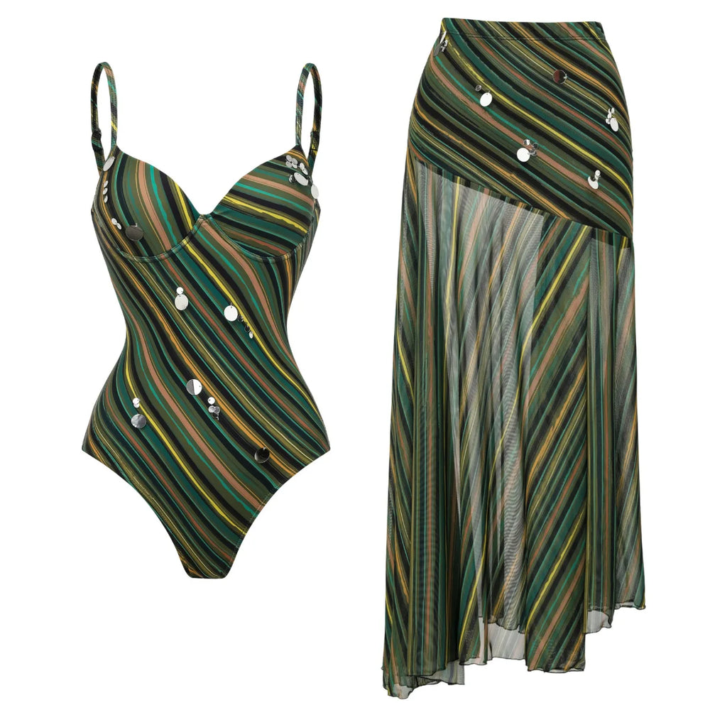 One-piece swimsuit with spaghetti straps and shell detail, shown with an asymmetrical maxi skirt.