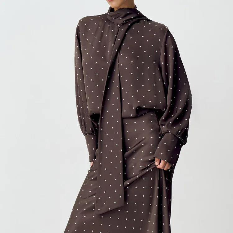 Brown polka dot dress on a plain background