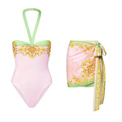 One-piece swimsuit with baroque print and green trim.