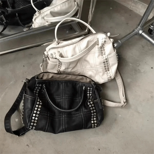 Black quilted rivet tote bag