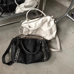Black quilted rivet tote bag