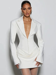 White blazer dress worn by a model on a plain background