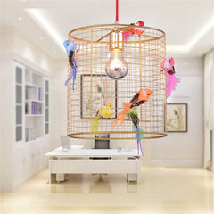  Nordic birdcage chandelier hanging in a clothing store display window, showcasing its unique design. Golden Atelier 2