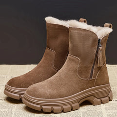 A pair of stylish suede leather snow boots with a warm plush lining and convenient side zippers.