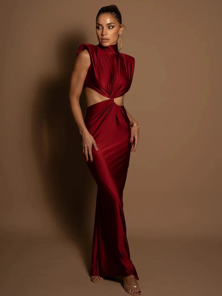 Woman wearing a red evening gown against a brown background