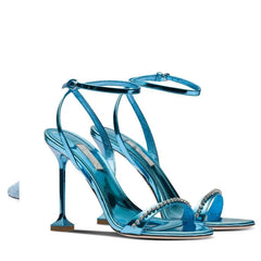 Close-up of a Golden Atelier high heel sandal with a diamond-encrusted ankle strap, highlighting the intricate details. Blue 2