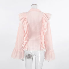 Pink blouse with ruffled sleeves on a mannequin against a white background