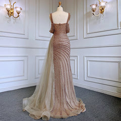 Mannequin displaying the caramel mermaid evening gown, showcasing its flattering silhouette and flowing train. Golden Atelier 3