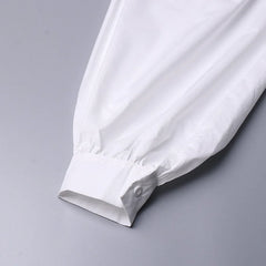 White shirt sleeve on a gray background